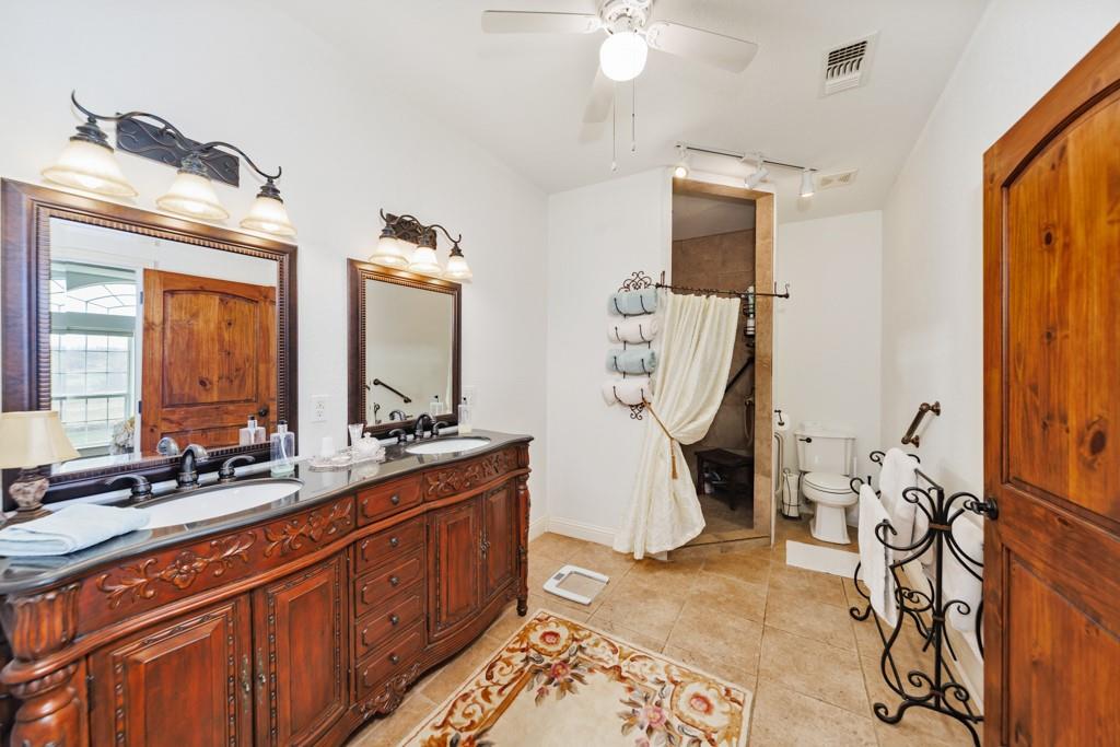 4460 Hildreth Pool Road Bowie, TX 76230 - Photo 18 of 40 a room with gym equipment and large mirror