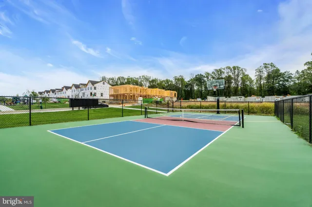 swimming pool view with a outdoor seating space