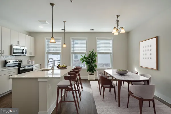 a view of a dining room with furniture window and wooden floor