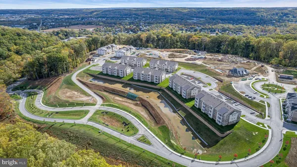 a aerial view of a house with a swimming pool