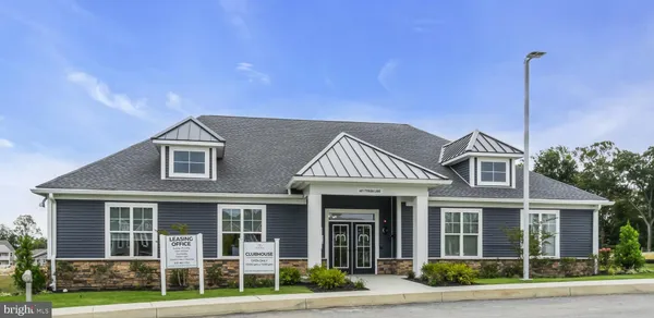 a view of a play ground in front of a house