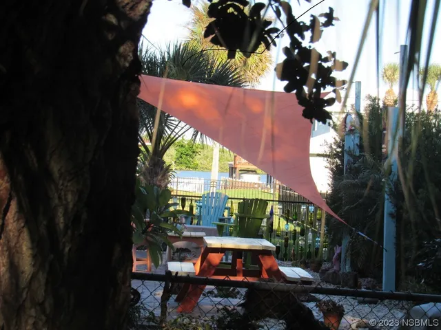 view of an outdoor sitting area with golf course