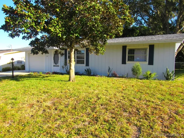 a house view with swimming pool