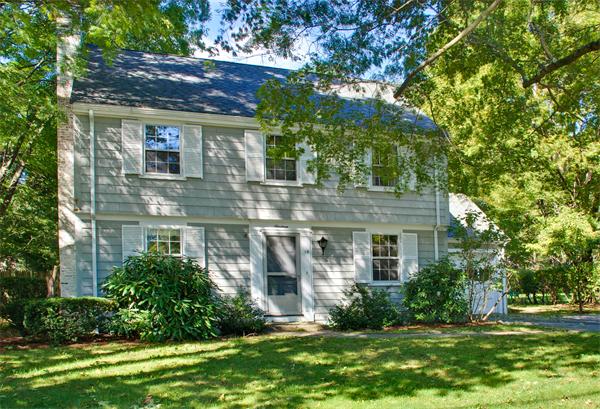 a view of house with yard and green space