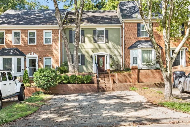 a view of a front of a house with a yard