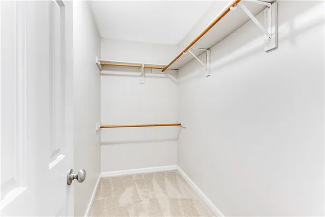 a view of an empty walk in closet