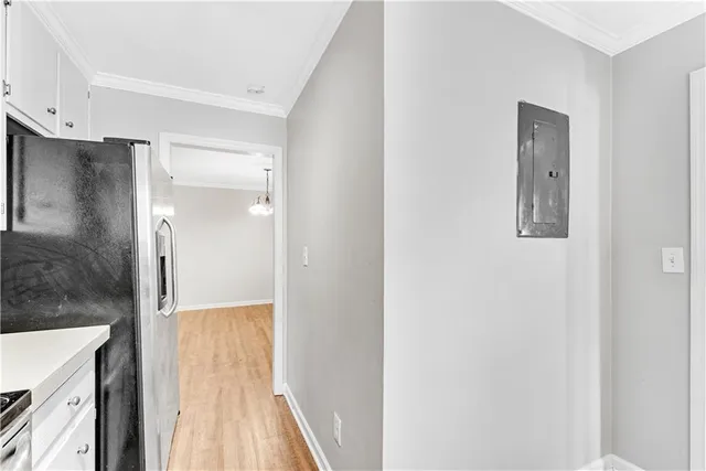 a bathroom with a glass shower door and a mirror