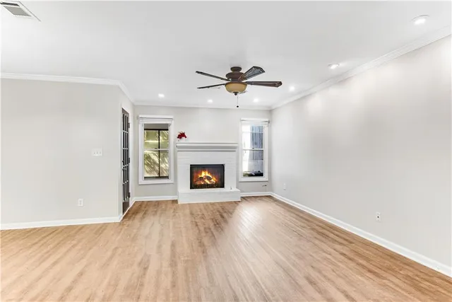 wooden floor in an empty room with a fireplace