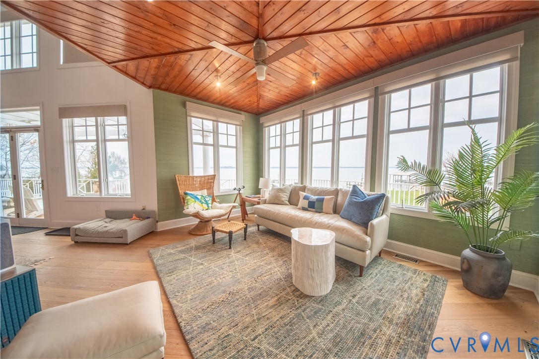 463 Rockingham Road Dunnsville, VA 22454 - Photo 11 of 47 a living room with furniture and a large window