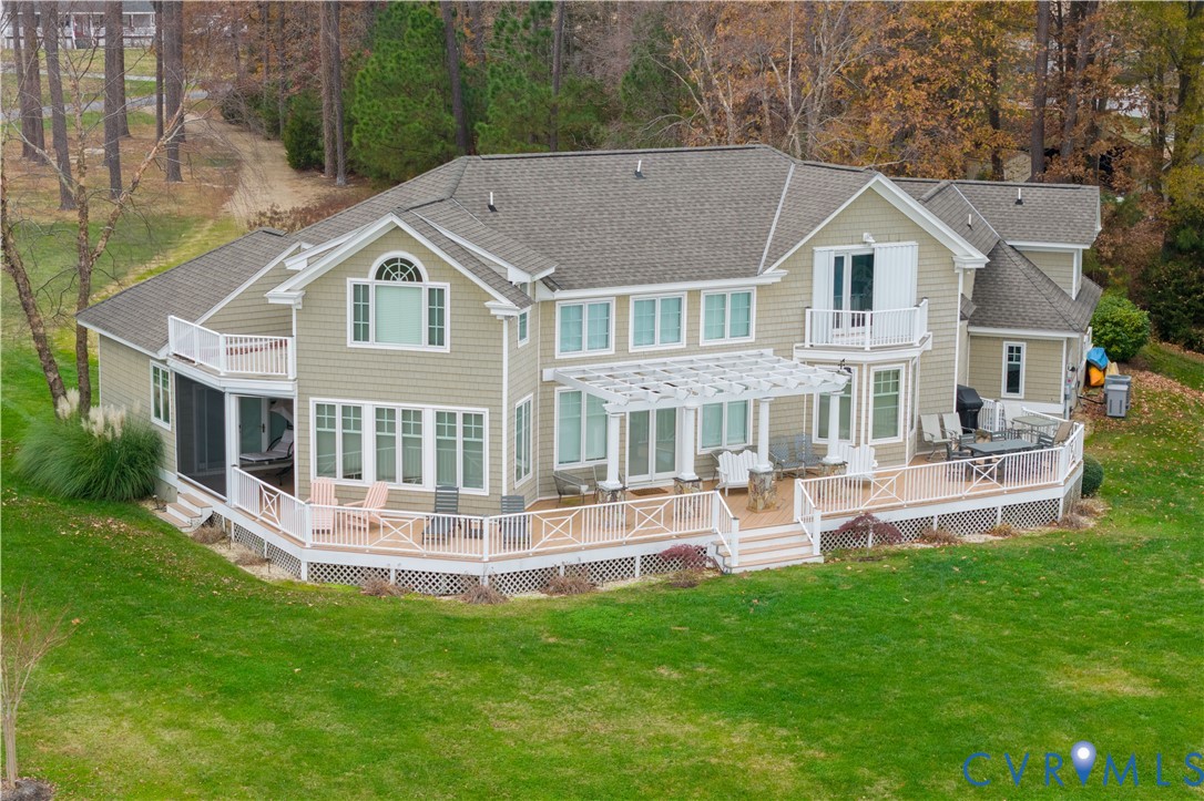 463 Rockingham Road Dunnsville, VA 22454 - Photo 2 of 47 a aerial view of a house with a yard and sitting area