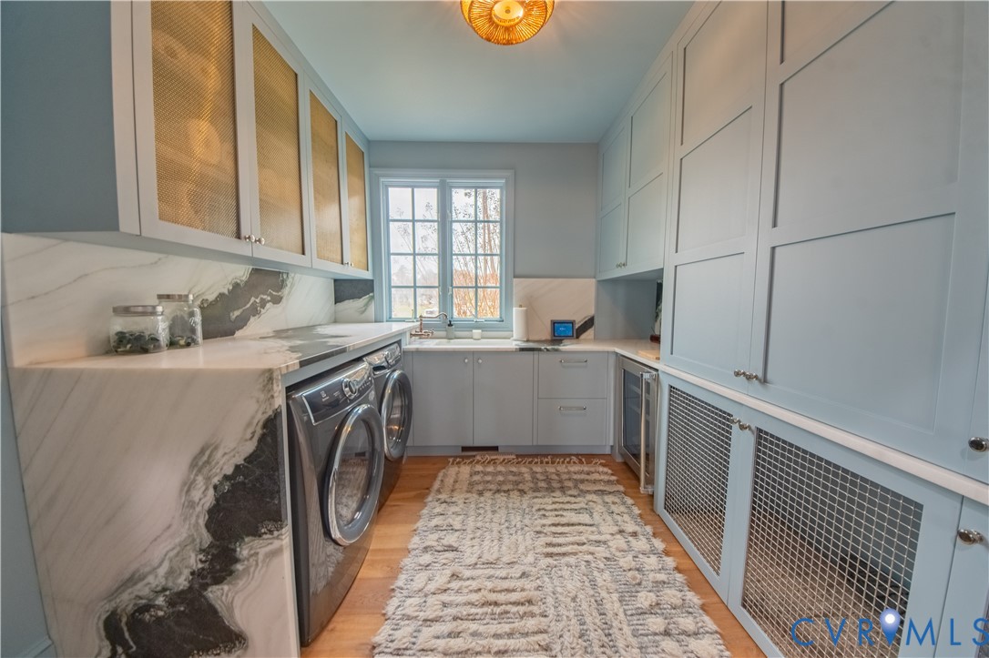 463 Rockingham Road Dunnsville, VA 22454 - Photo 21 of 47 a utility room with sink dryer and washer