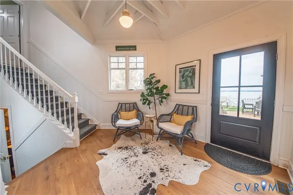 a bedroom with furniture and a chandelier
