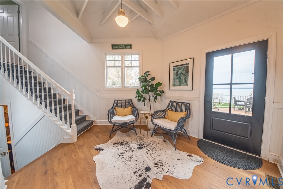 463 Rockingham Road Dunnsville, VA 22454 - Photo 23 of 47 a living room with furniture a rug and a window