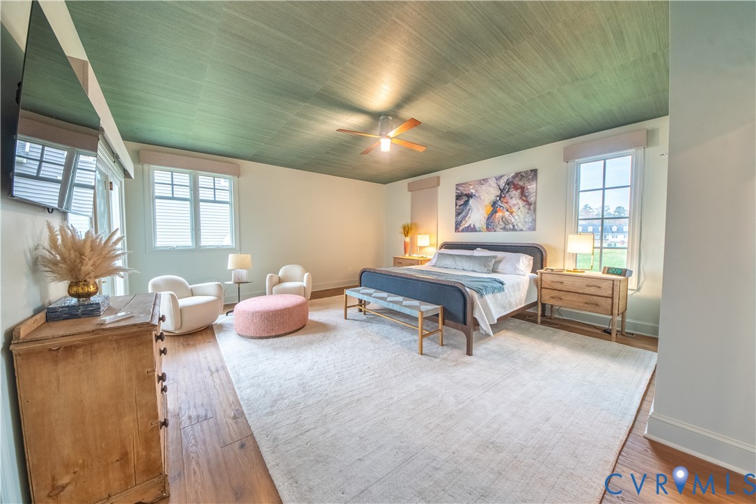 463 Rockingham Road Dunnsville, VA 22454 - Photo 24 of 47 a bedroom with furniture and a chandelier