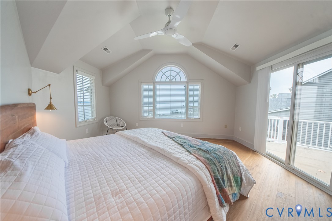 463 Rockingham Road Dunnsville, VA 22454 - Photo 30 of 47 a bedroom with a large bed and a window