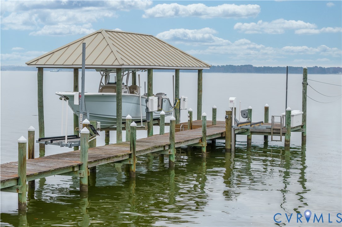 463 Rockingham Road Dunnsville, VA 22454 - Photo 3 of 47 a small pool sitting in the middle of a lake