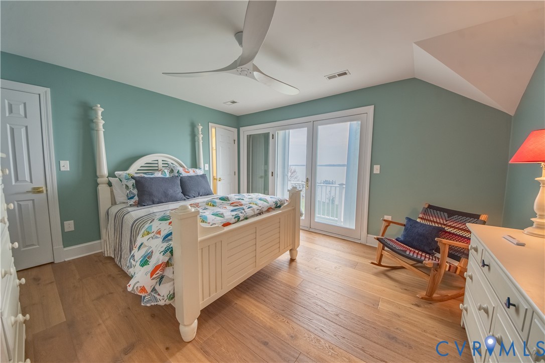 463 Rockingham Road Dunnsville, VA 22454 - Photo 32 of 47 a bed room with a bed and a chair