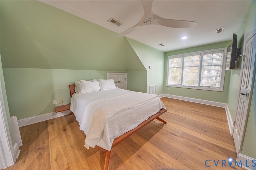 463 Rockingham Road Dunnsville, VA 22454 - Photo 34 of 47 a bedroom with a bed and a window