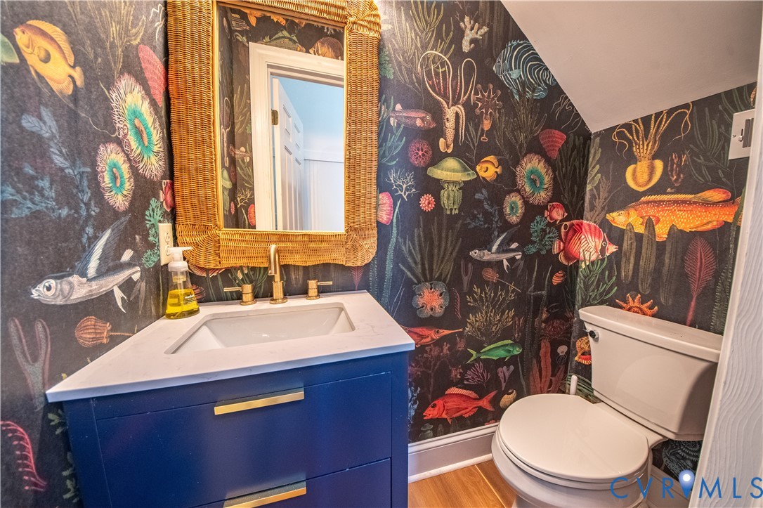 463 Rockingham Road Dunnsville, VA 22454 - Photo 36 of 47 a bathroom with a sink mirror vanity and toilet
