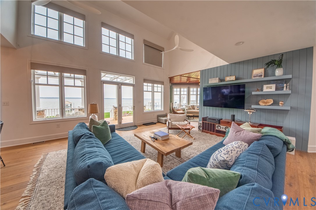 463 Rockingham Road Dunnsville, VA 22454 - Photo 37 of 47 a living room with furniture and a flat screen tv