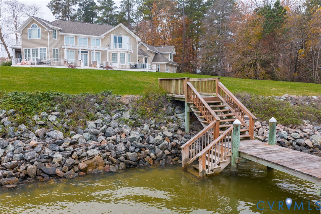 463 Rockingham Road Dunnsville, VA 22454 - Photo 41 of 47 a view of a house with a yard from a lake view