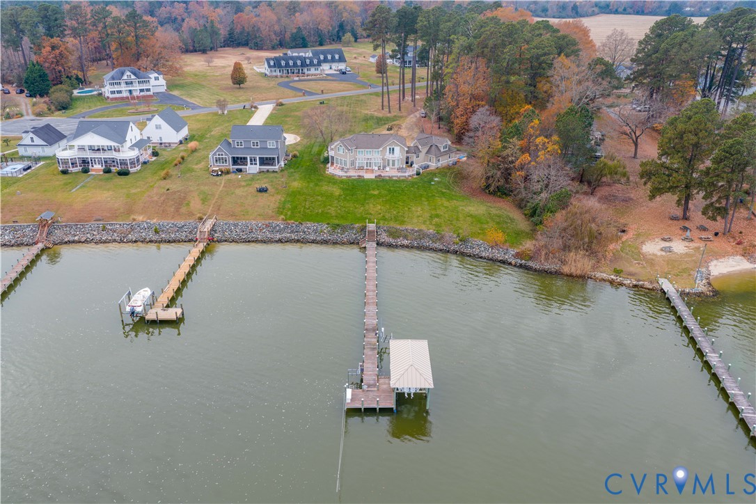 463 Rockingham Road Dunnsville, VA 22454 - Photo 42 of 47 an aerial view of a house with a lake view