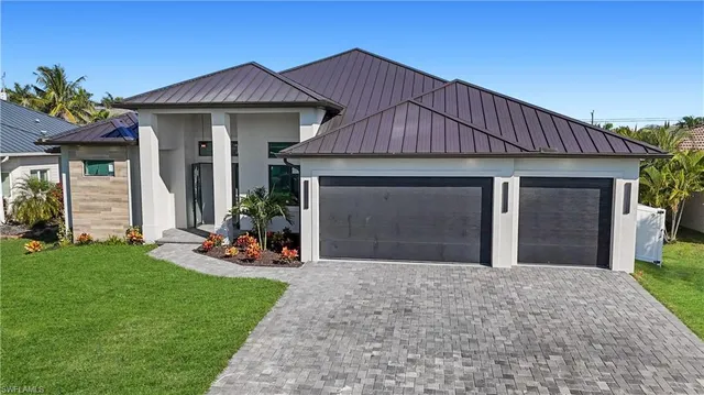 a front view of a house with a yard and porch