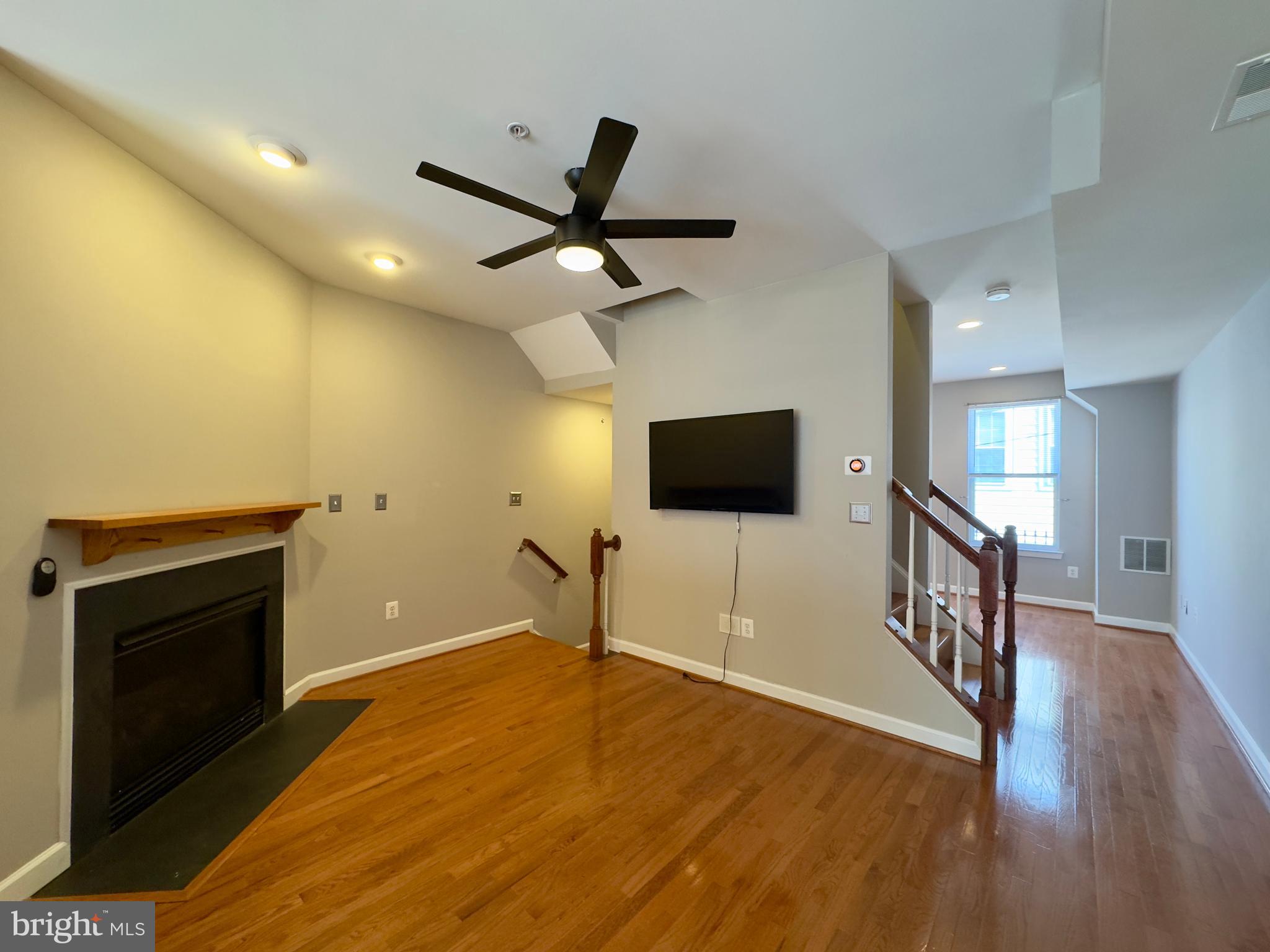124 South Duncan Street Baltimore, MD 21231 - Photo 19 of 30 a living room with a flat screen tv and a wooden floor