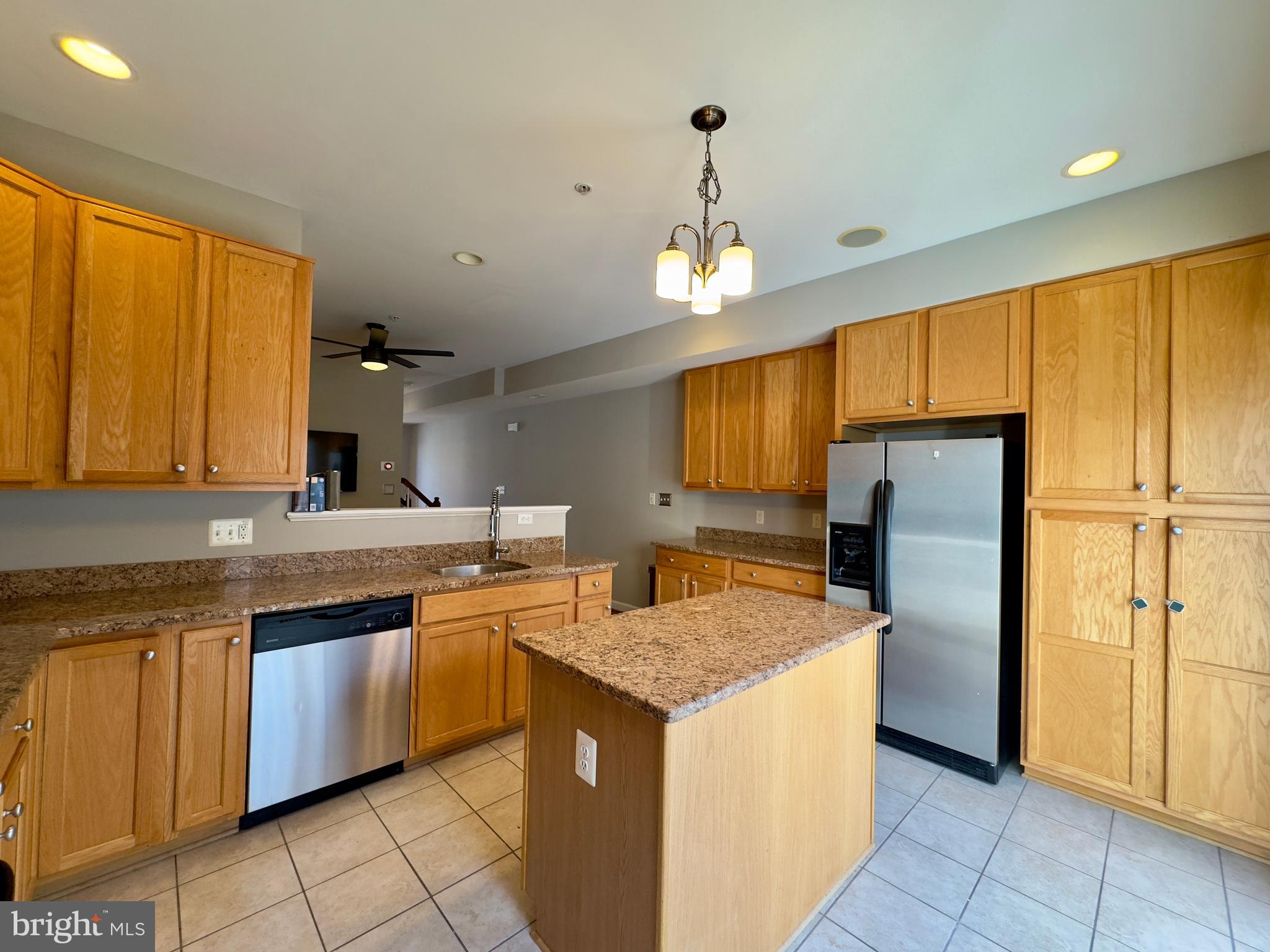 124 South Duncan Street Baltimore, MD 21231 - Photo 21 of 30 a kitchen with stainless steel appliances granite countertop a sink and a refrigerator