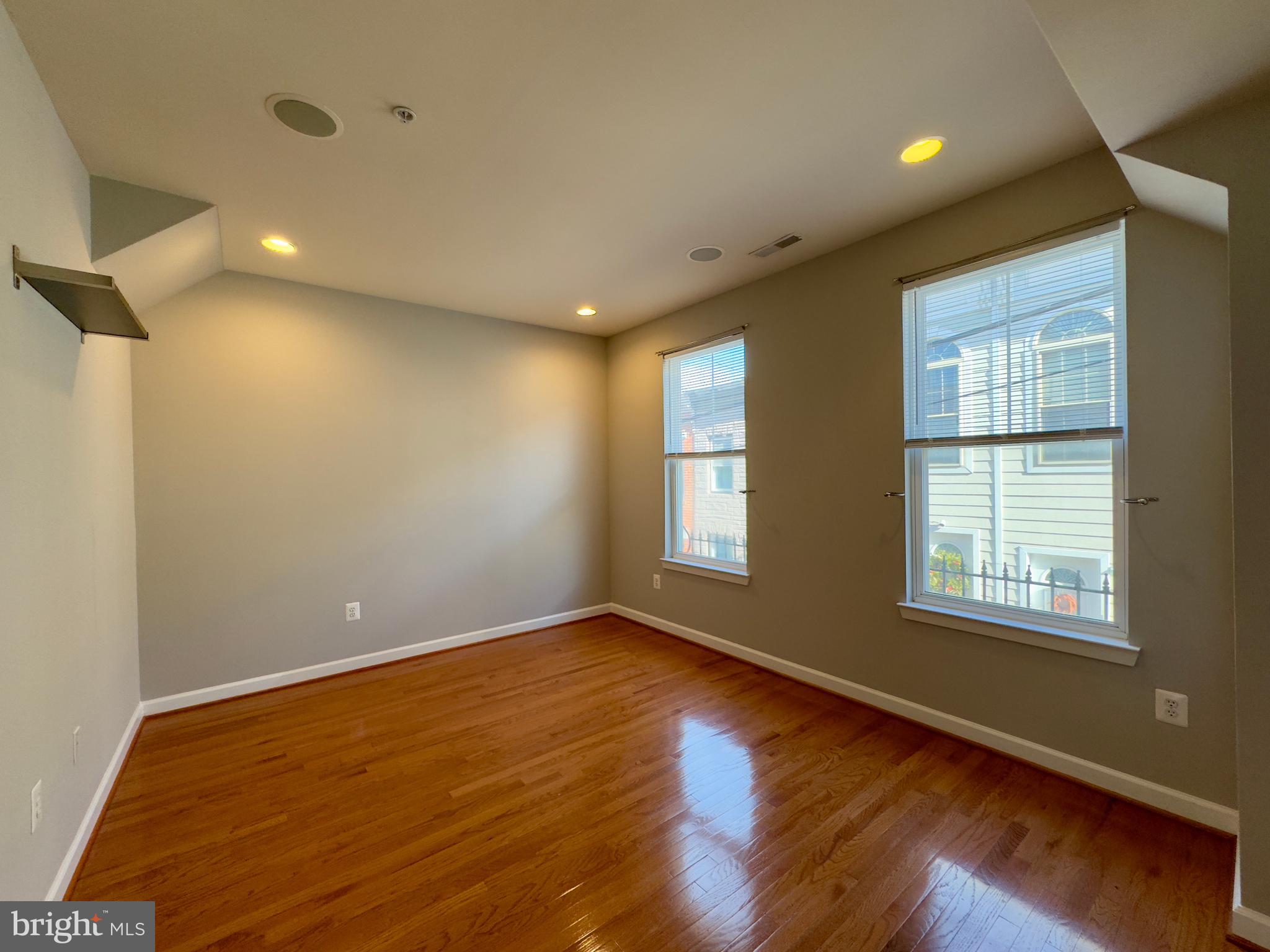 124 South Duncan Street Baltimore, MD 21231 - Photo 22 of 30 a view of an empty room with wooden floor and a window