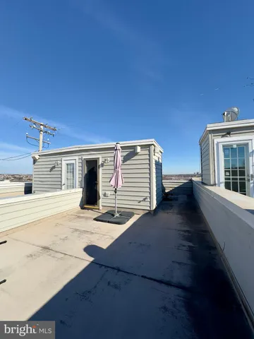 a view of a house with backyard and wooden floor