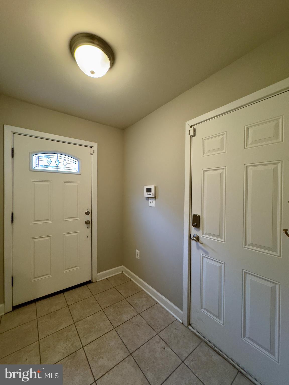 124 South Duncan Street Baltimore, MD 21231 - Photo 9 of 30 an empty room with wooden floor and mirror