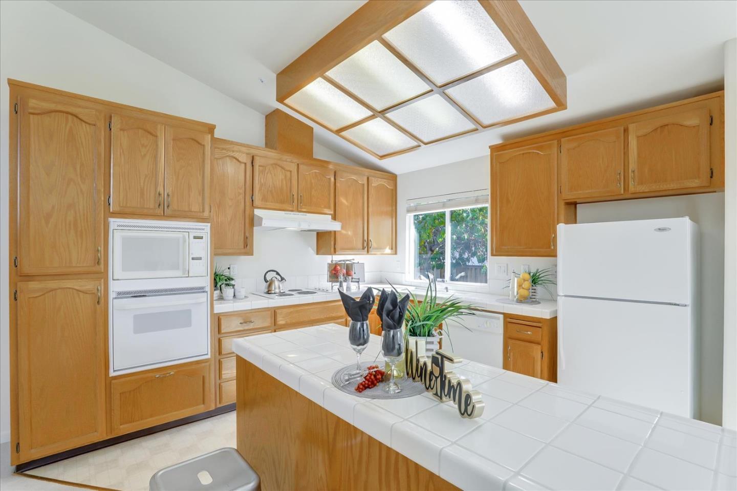 883 Marcella Street Livermore, CA 94550 - Photo 12 of 44 a kitchen with stainless steel appliances a refrigerator sink and cabinets