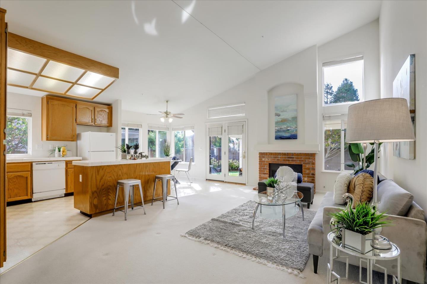 883 Marcella Street Livermore, CA 94550 - Photo 19 of 44 a living room with furniture a fireplace and a table