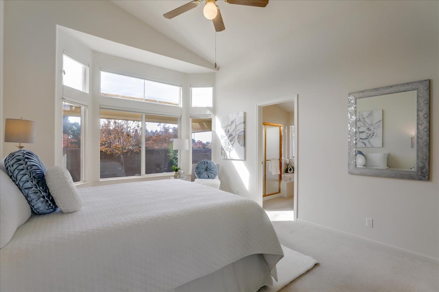 883 Marcella Street Livermore, CA 94550 - Photo 20 of 44 a bedroom with a large bed and a large window