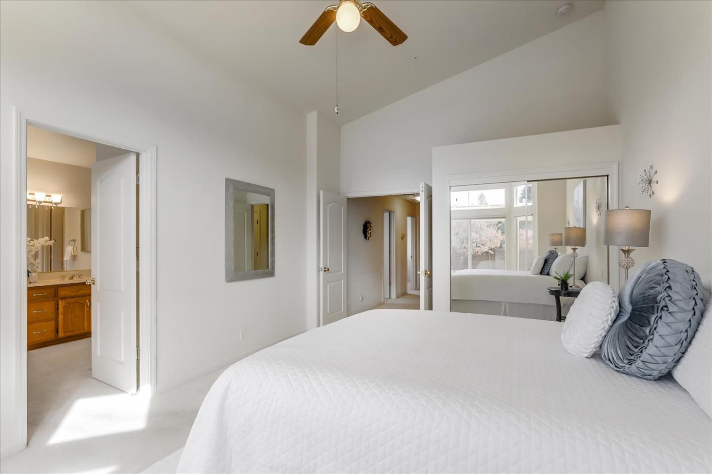 883 Marcella Street Livermore, CA 94550 - Photo 23 of 44 a bedroom with a bed and a chandelier