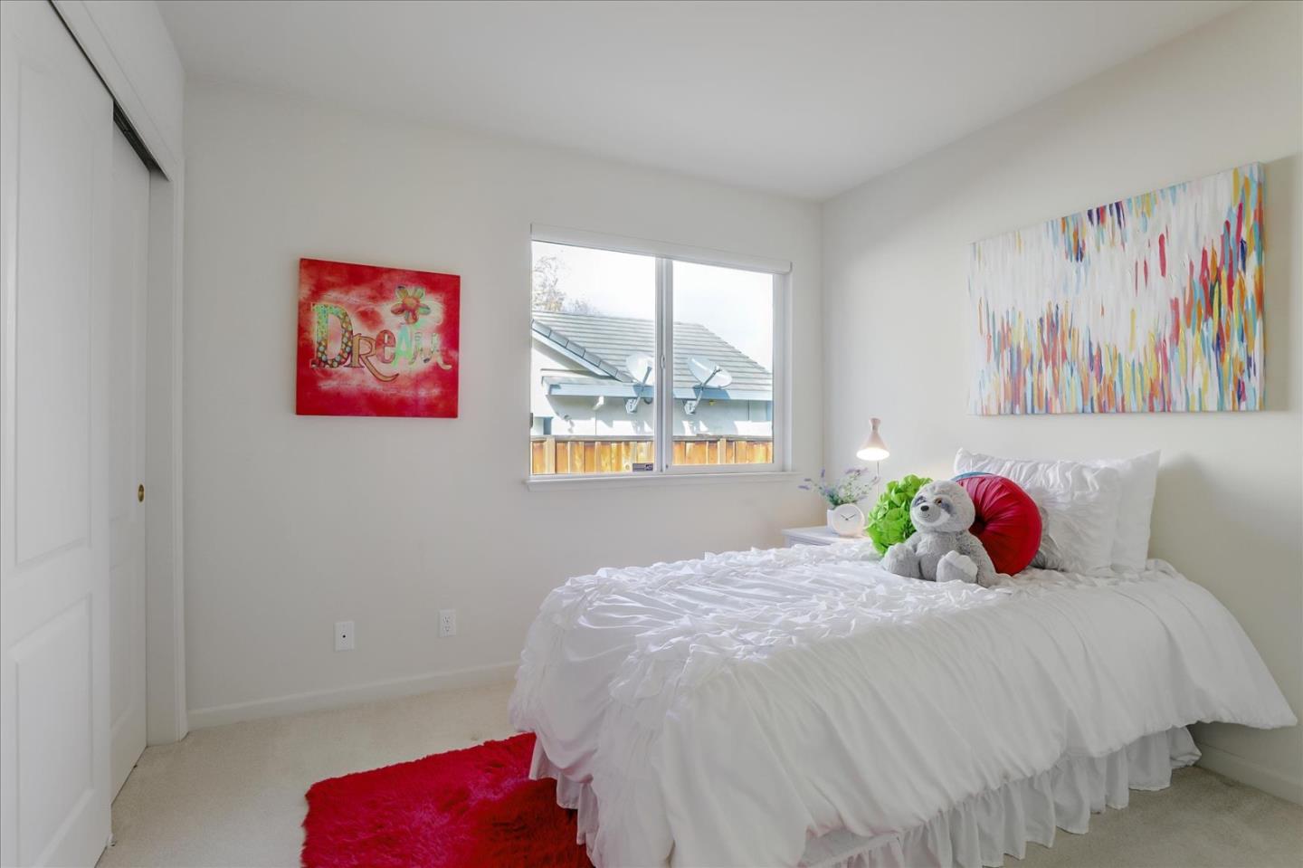 883 Marcella Street Livermore, CA 94550 - Photo 28 of 44 a bedroom with a bed and a window