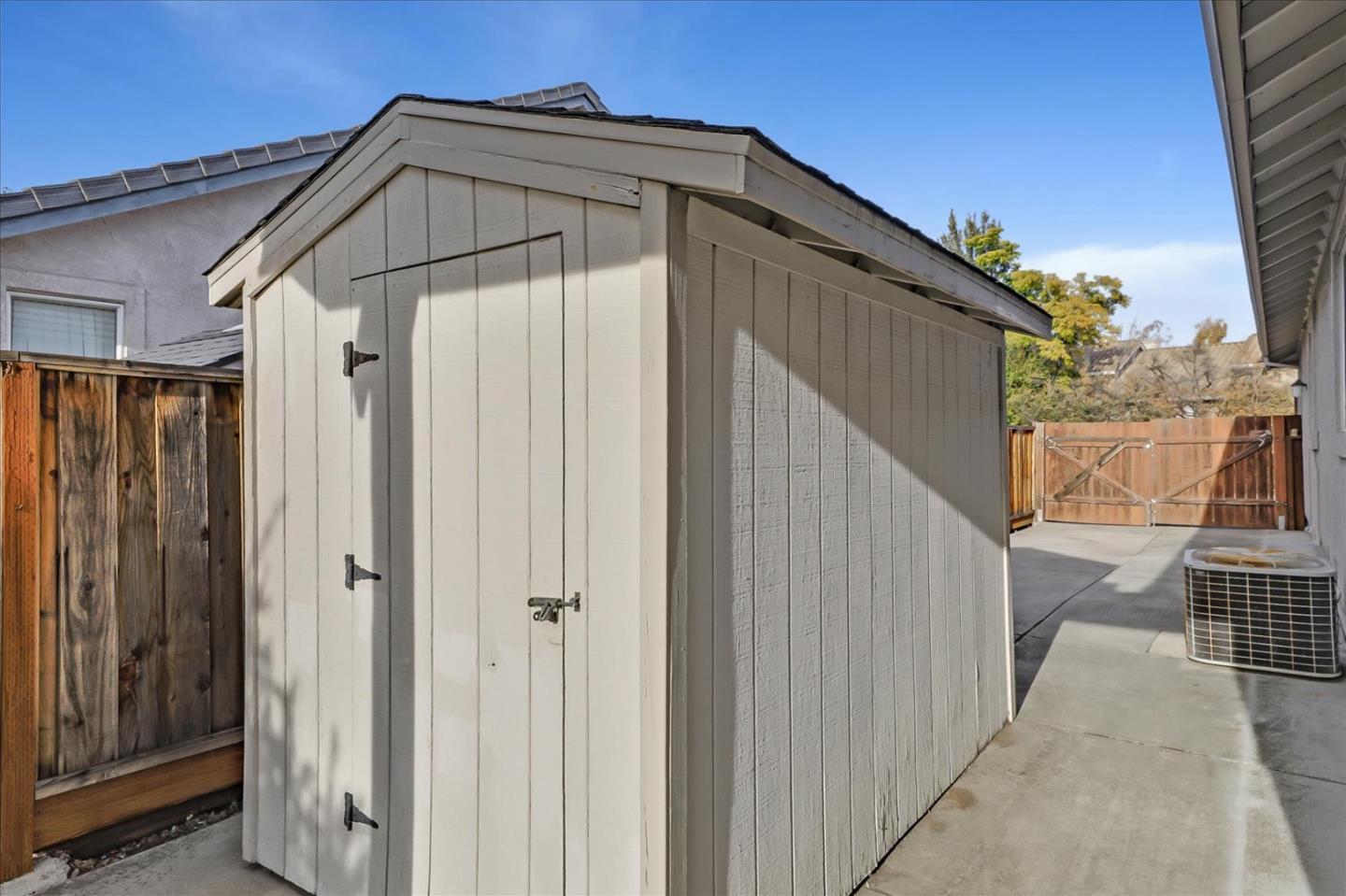 883 Marcella Street Livermore, CA 94550 - Photo 38 of 44 a view of a wooden door with a house