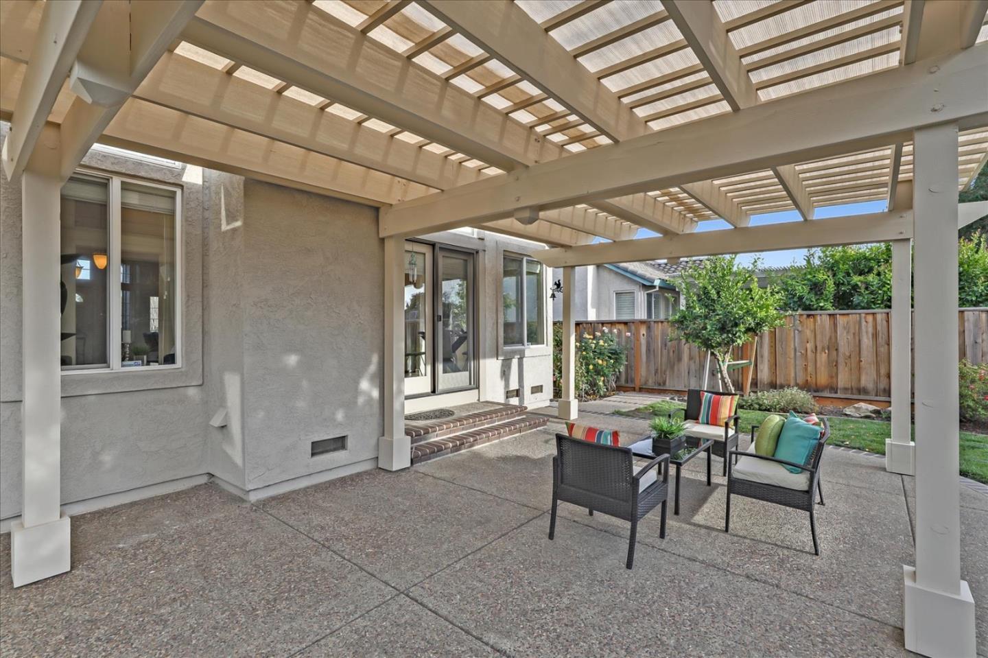 883 Marcella Street Livermore, CA 94550 - Photo 42 of 44 a patio with yard glass top table and chairs