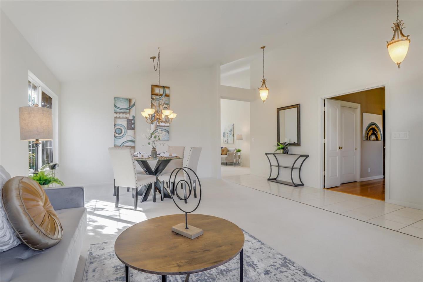 883 Marcella Street Livermore, CA 94550 - Photo 8 of 44 a living room with furniture and a chandelier