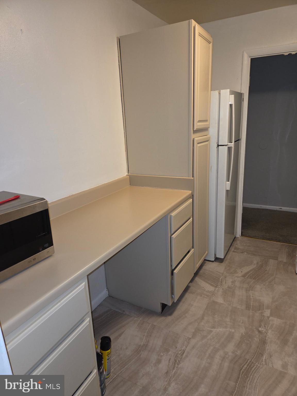 204 St Barnabas Road, Unit T Suitland, MD 20746 - Photo 5 of 10 a kitchen with stainless steel appliances a refrigerator and a stove