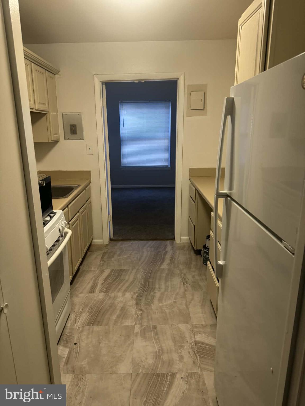 204 St Barnabas Road, Unit T Suitland, MD 20746 - Photo 6 of 10 a bathroom with a sink a toilet and a mirror