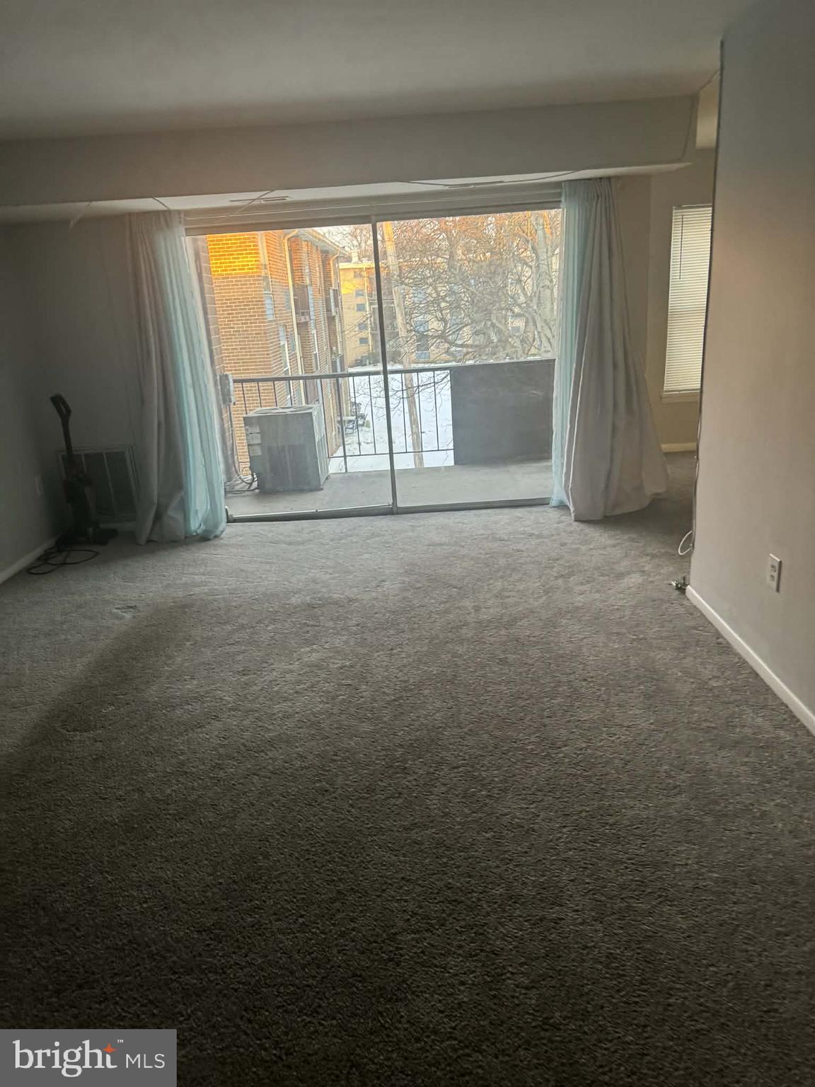 204 St Barnabas Road, Unit T Suitland, MD 20746 - Photo 7 of 10 an empty room with an empty space and windows