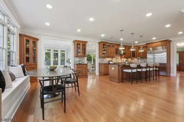a kitchen with a table and chairs in it
