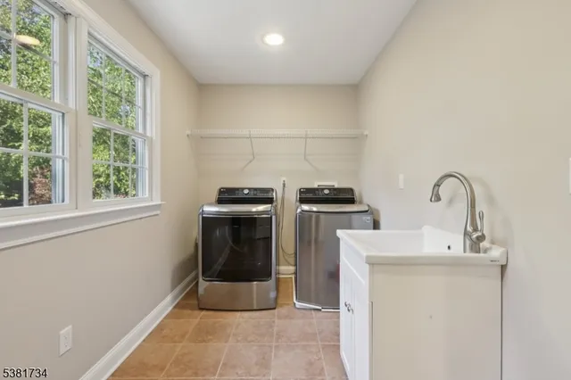 a kitchen with a sink and a stove top oven