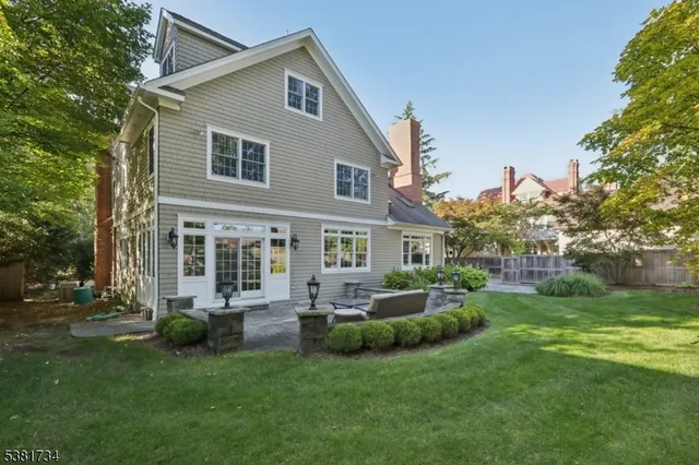 a view of a house with a backyard