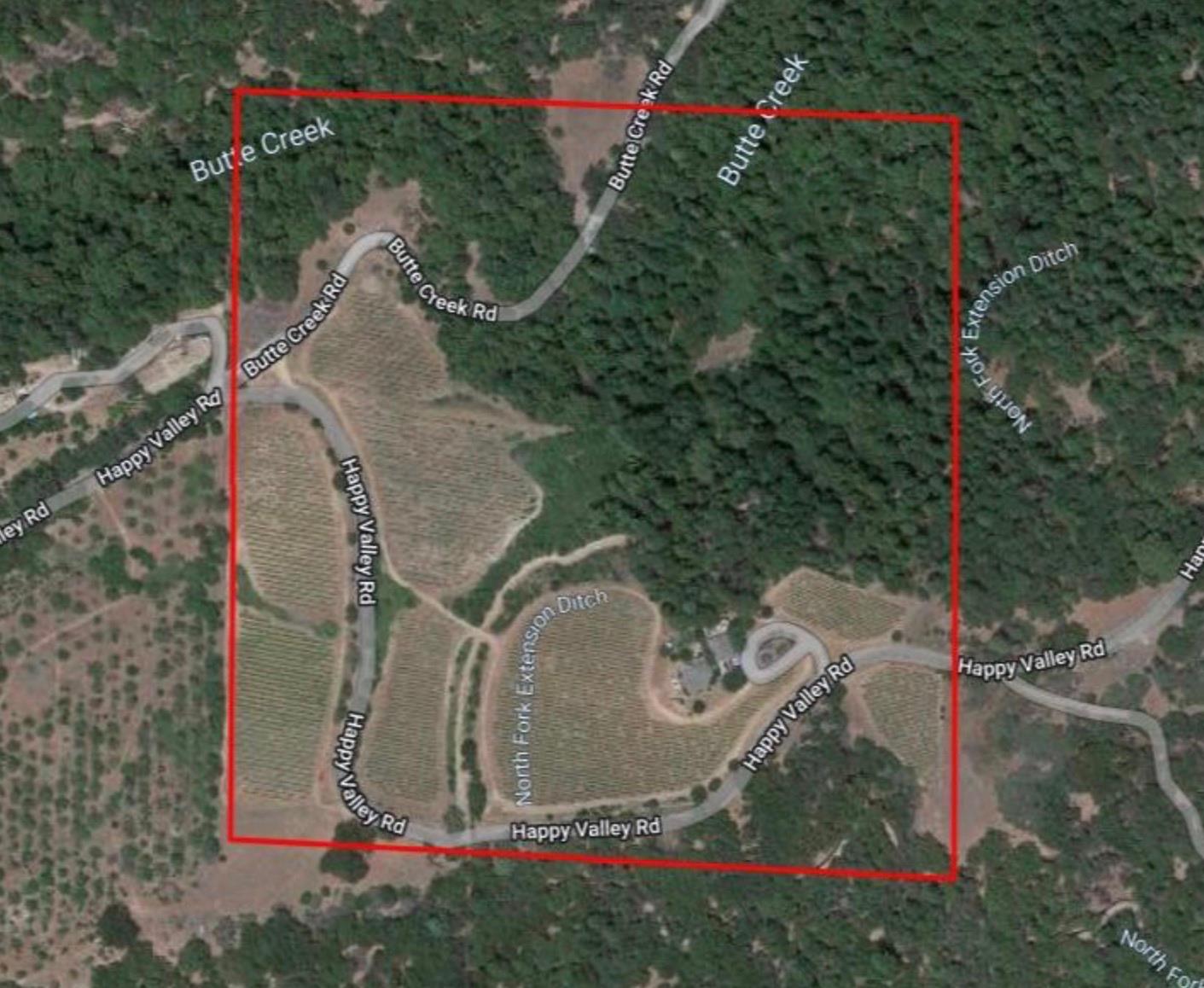 7201 Happy Valley Road Somerset, CA 95684 - Photo 63 of 75 The lot is half forested land and half vineyard, and has year-round Butte Creek running through the lot with a bbq or picnic sitting area by the creek.