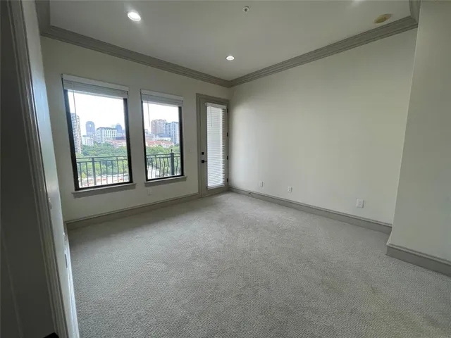 a bathroom with a sink a toilet and a large mirror