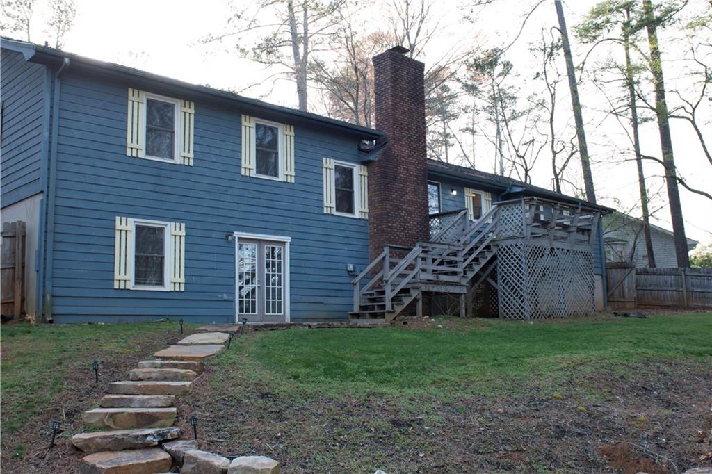 3626 Thompson Bend Gainesville, GA 30506 - Photo 13 of 14 a brick house with a yard plants and large tree