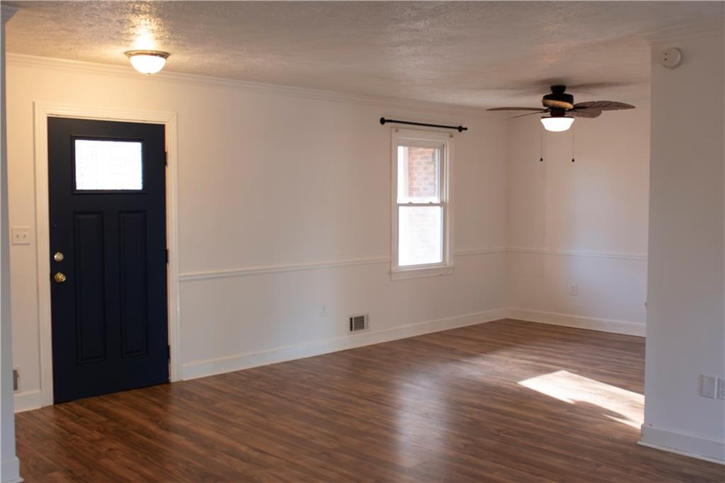 3626 Thompson Bend Gainesville, GA 30506 - Photo 4 of 14 a view of empty room with wooden floor and fan